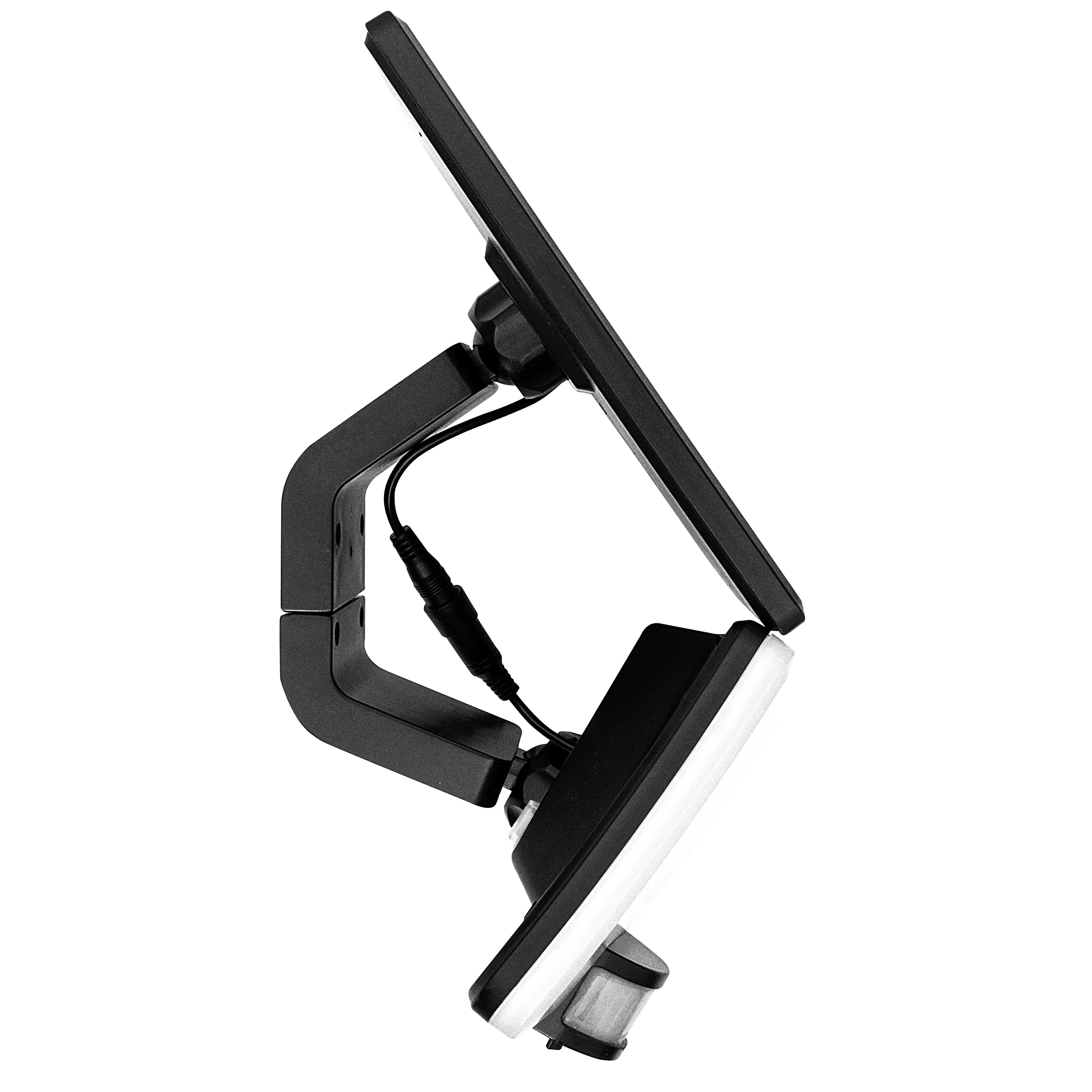 Black adjustable clamp with a white light bulb on a white background